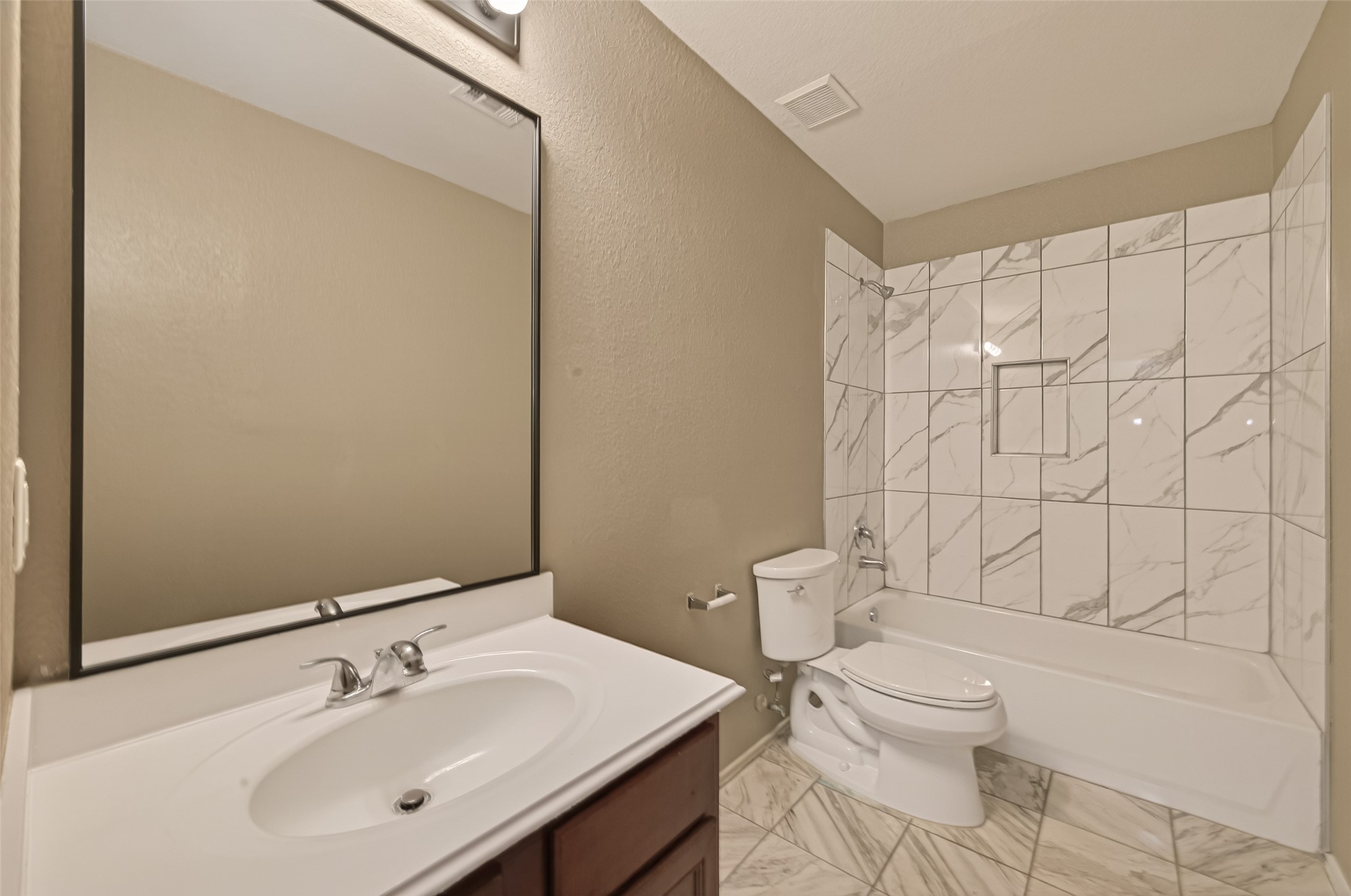 2918 Latch Lane Houston, TX 77038 - Photo 20 of 23 a bathroom with a sink a toilet and shower