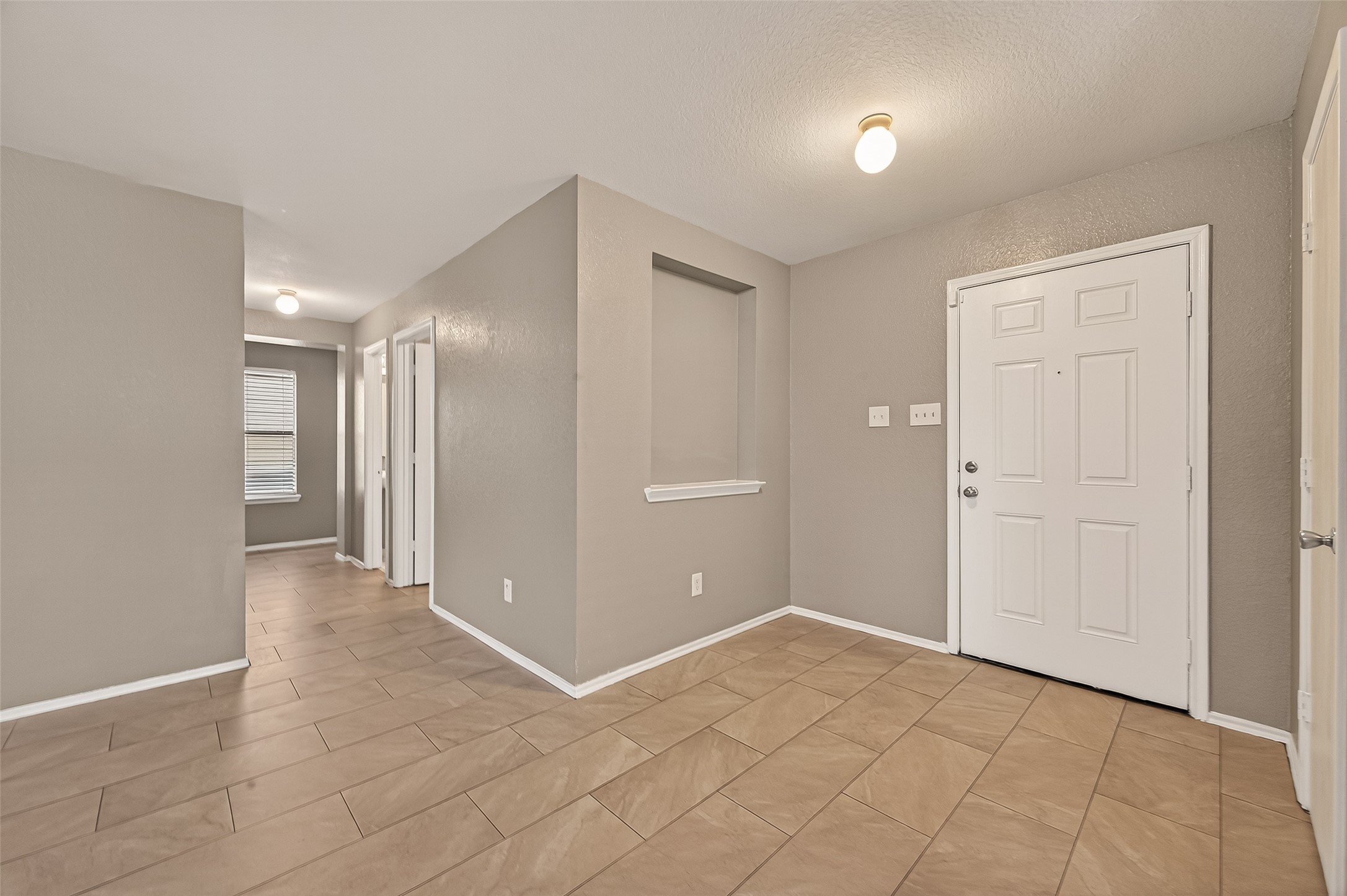 2918 Latch Lane Houston, TX 77038 - Photo 22 of 23 a view of a hallway with wooden shelves