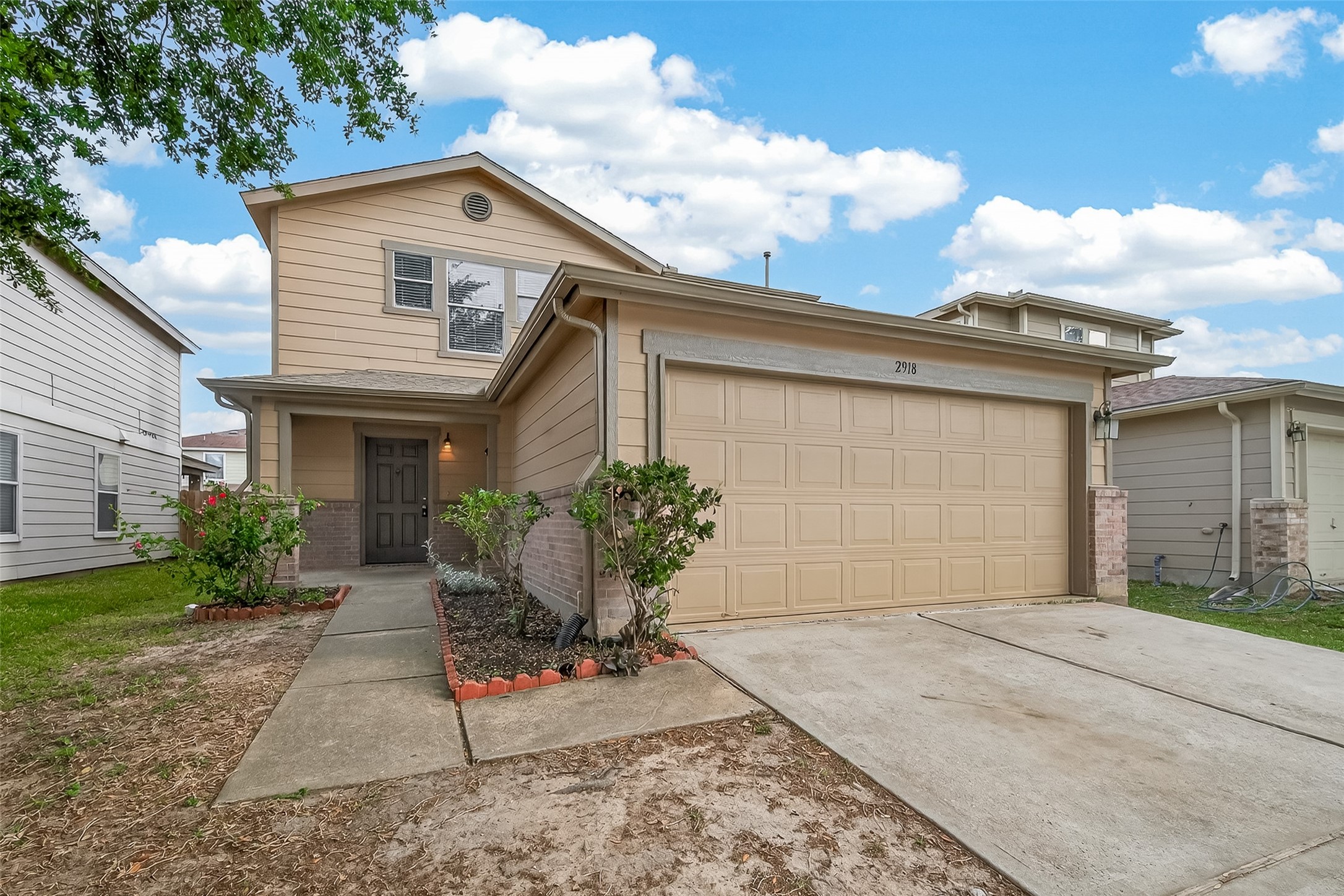 2918 Latch Lane Houston, TX 77038 - Photo 3 of 23 a front view of a house with garden