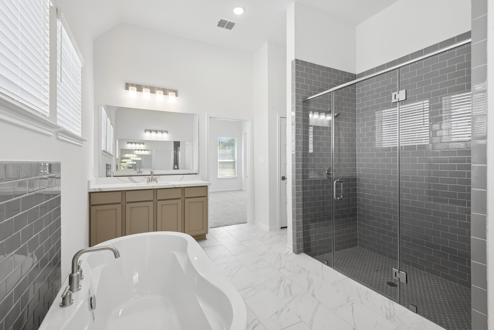 5017 Bluebell Way Waller, TX 77484 - Photo 14 of 23 Relaxing primary bath (*Photo not of actual home and used for illustration purposes only.)