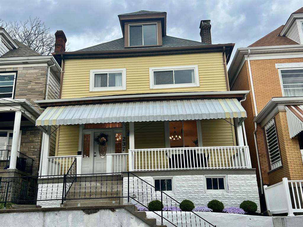 237 Lelia Street Pittsburgh, PA 15211 - Photo 1 of 46 a front view of a house with entryway