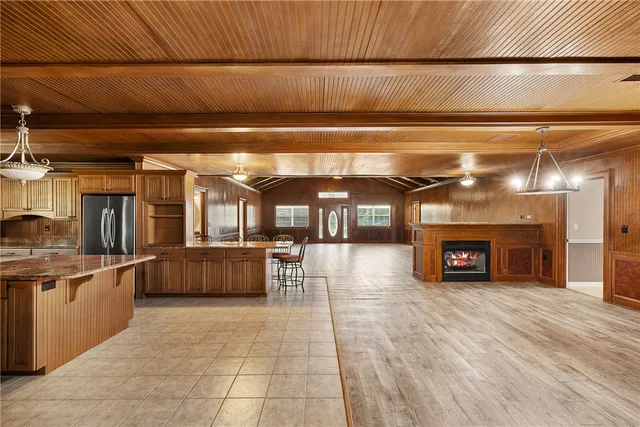 a view of a room with furniture and a fireplace