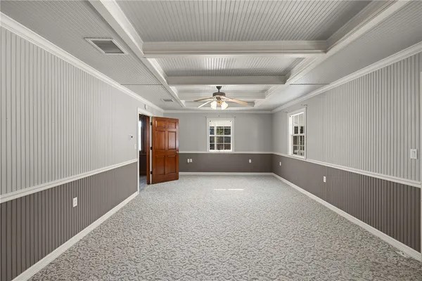 a spacious bathroom with a tub sink and mirror