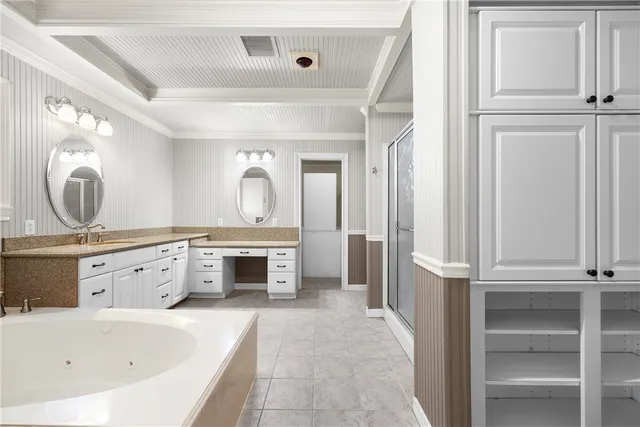 a bathroom with a bathtub a toilet a sink and mirrors