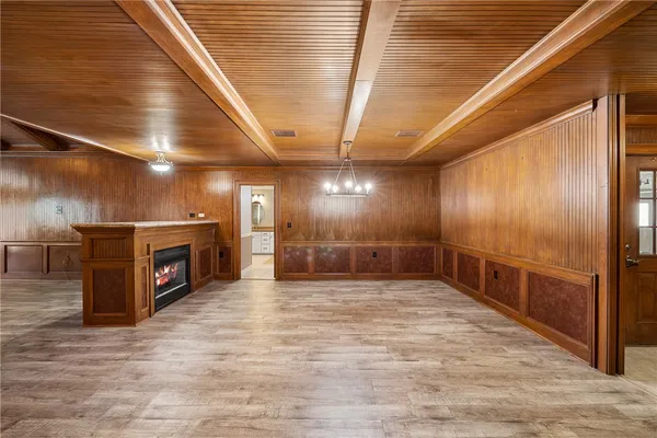 a view of an empty room with a fireplace