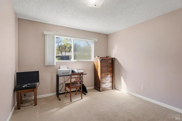 a view of workspace with furniture and window