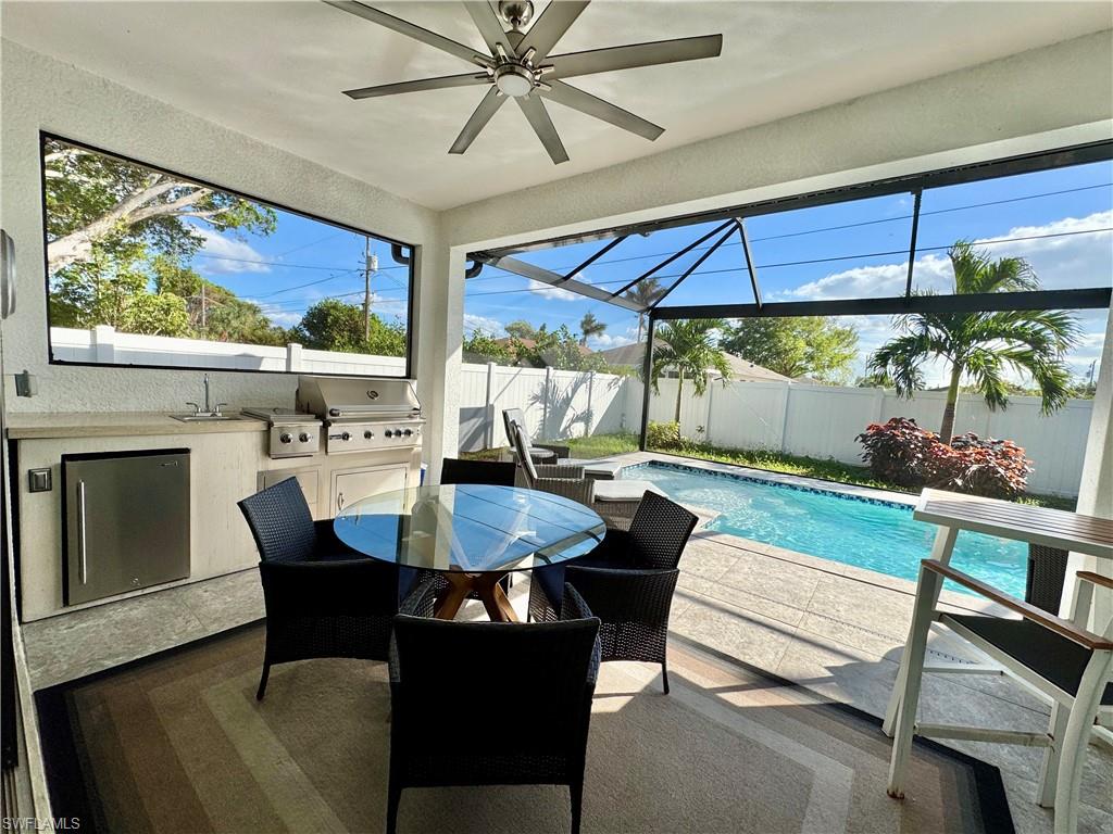 656 108th Avenue North Naples, FL 34108 - Photo 2 of 48 Screened in Outdoor kitchen and pool.