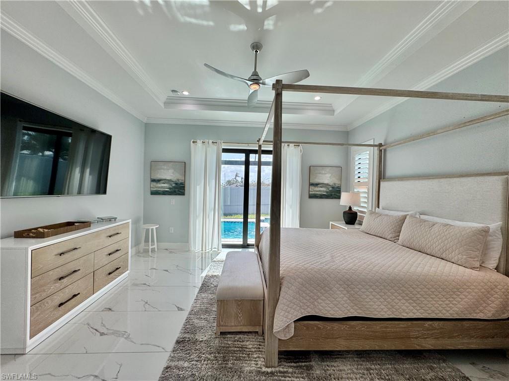 656 108th Avenue North Naples, FL 34108 - Photo 21 of 48 Bedroom featuring ceiling fan