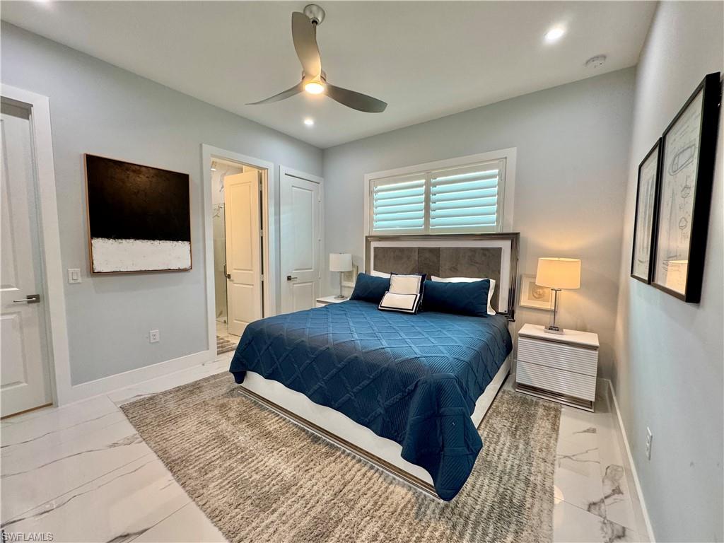 656 108th Avenue North Naples, FL 34108 - Photo 22 of 48 Bedroom featuring ceiling fan