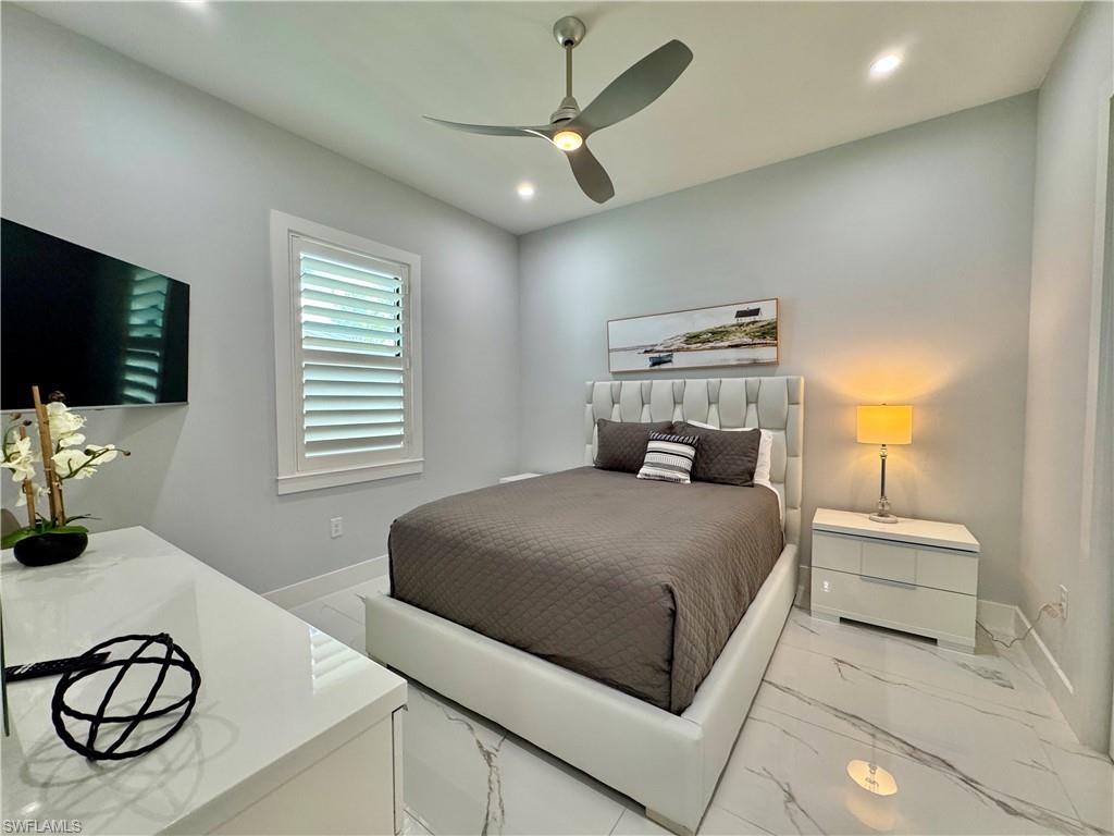 656 108th Avenue North Naples, FL 34108 - Photo 32 of 48 Bedroom featuring ceiling fan