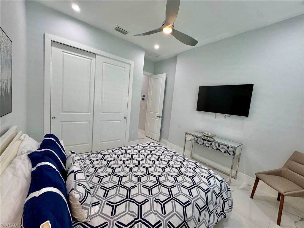 656 108th Avenue North Naples, FL 34108 - Photo 37 of 48 Bedroom featuring ceiling fan