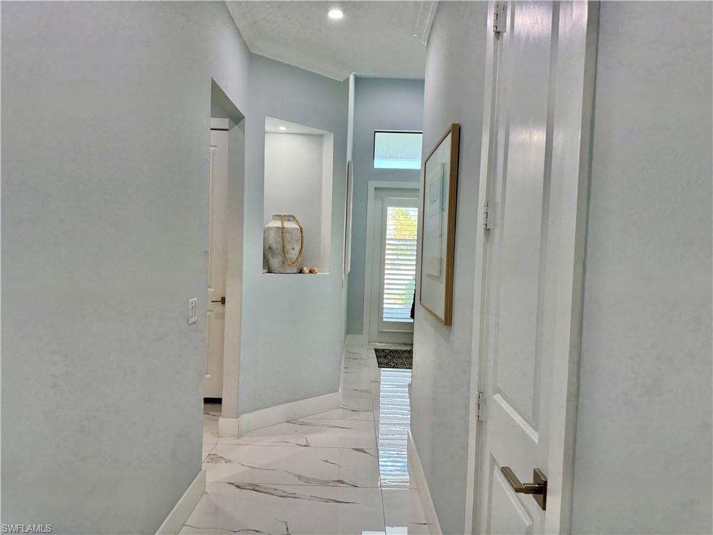 656 108th Avenue North Naples, FL 34108 - Photo 40 of 48 Corridor looking back to the enty.
