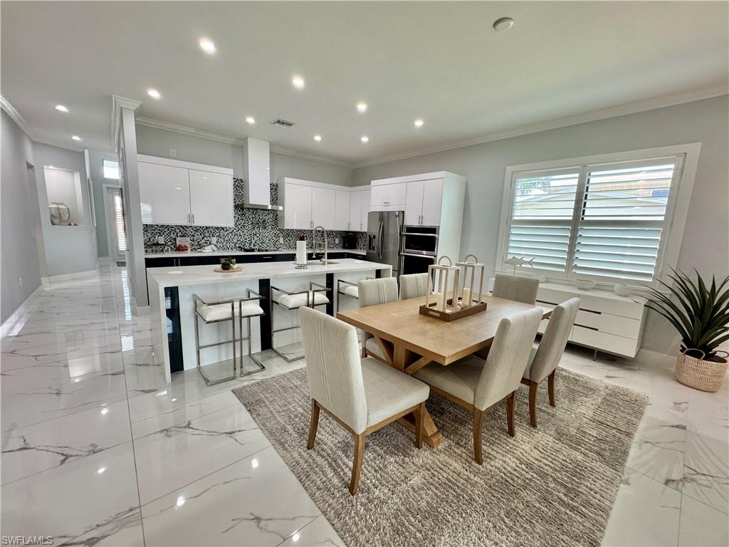 656 108th Avenue North Naples, FL 34108 - Photo 7 of 48 Dining room with dining table and 6 dining chairs