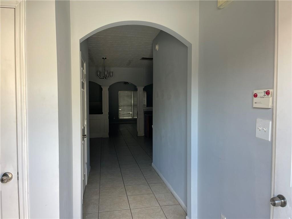 1538 Viero Drive Duluth, GA 30096 - Photo 5 of 8 a view of a hallway with wooden shelves