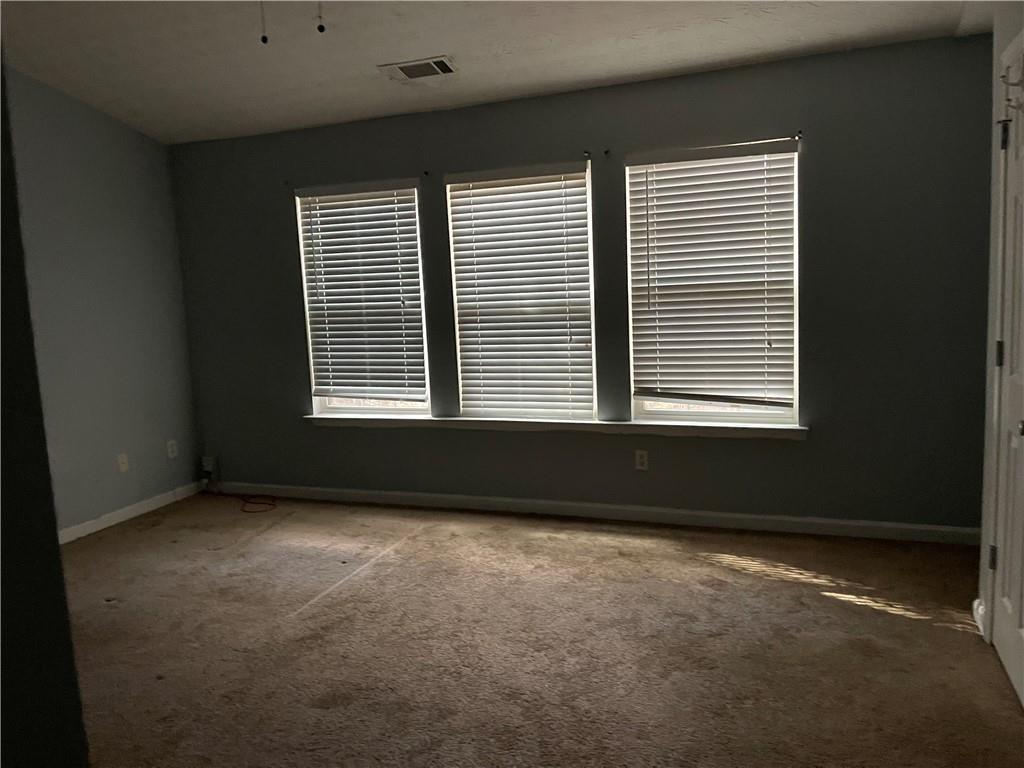 1538 Viero Drive Duluth, GA 30096 - Photo 6 of 8 a view of an empty room with a window