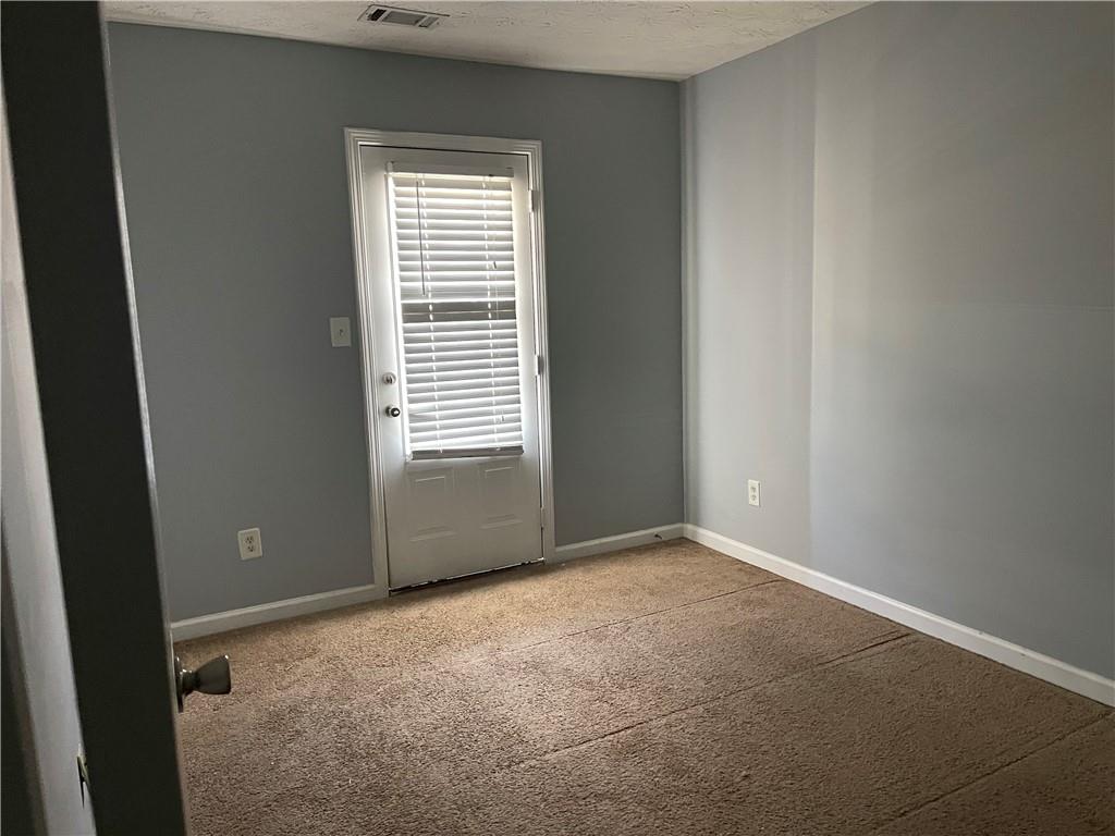 1538 Viero Drive Duluth, GA 30096 - Photo 8 of 8 an empty room with windows