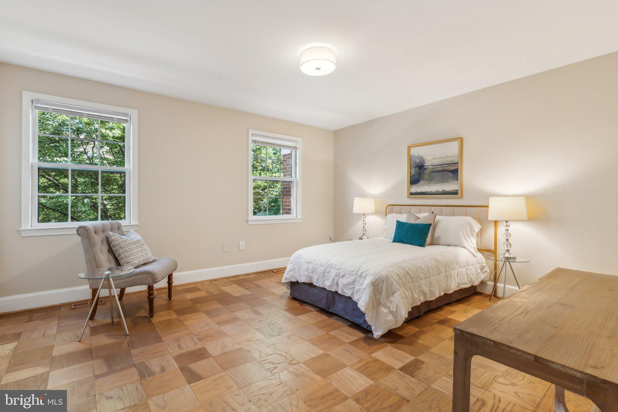 3205 Sutton Place Northwest, Unit A Washington, DC 20016 - Photo 18 of 44 a bedroom with a bed and a window
