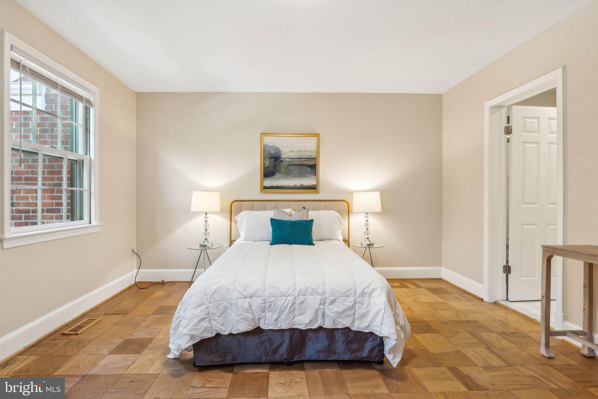 3205 Sutton Place Northwest, Unit A Washington, DC 20016 - Photo 20 of 44 a bedroom with a bed and a window