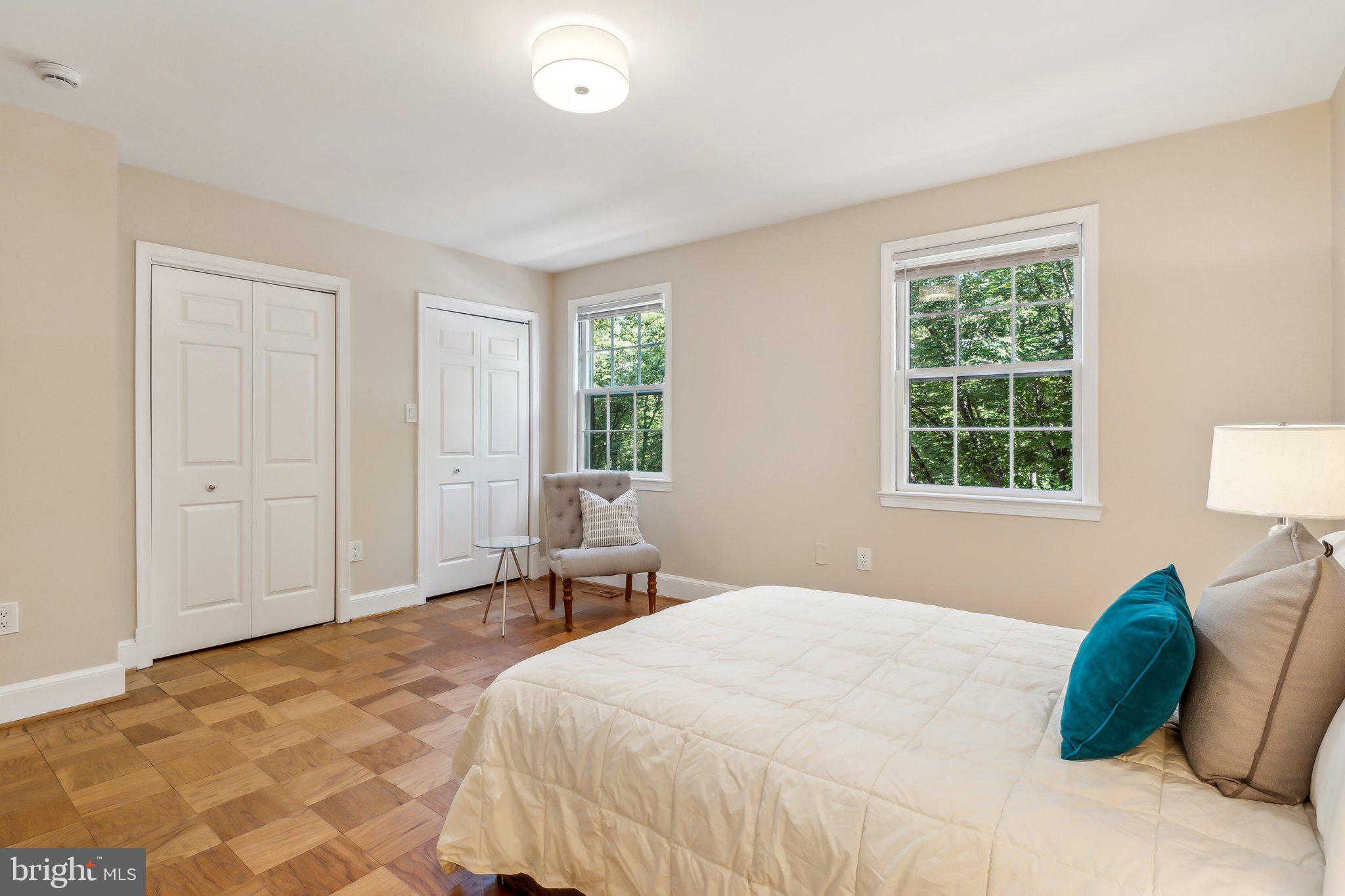 3205 Sutton Place Northwest, Unit A Washington, DC 20016 - Photo 21 of 44 a bedroom with a bed and a window