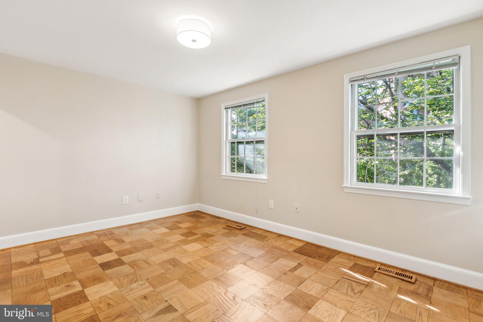 3205 Sutton Place Northwest, Unit A Washington, DC 20016 - Photo 29 of 44 a view of an empty room with a window