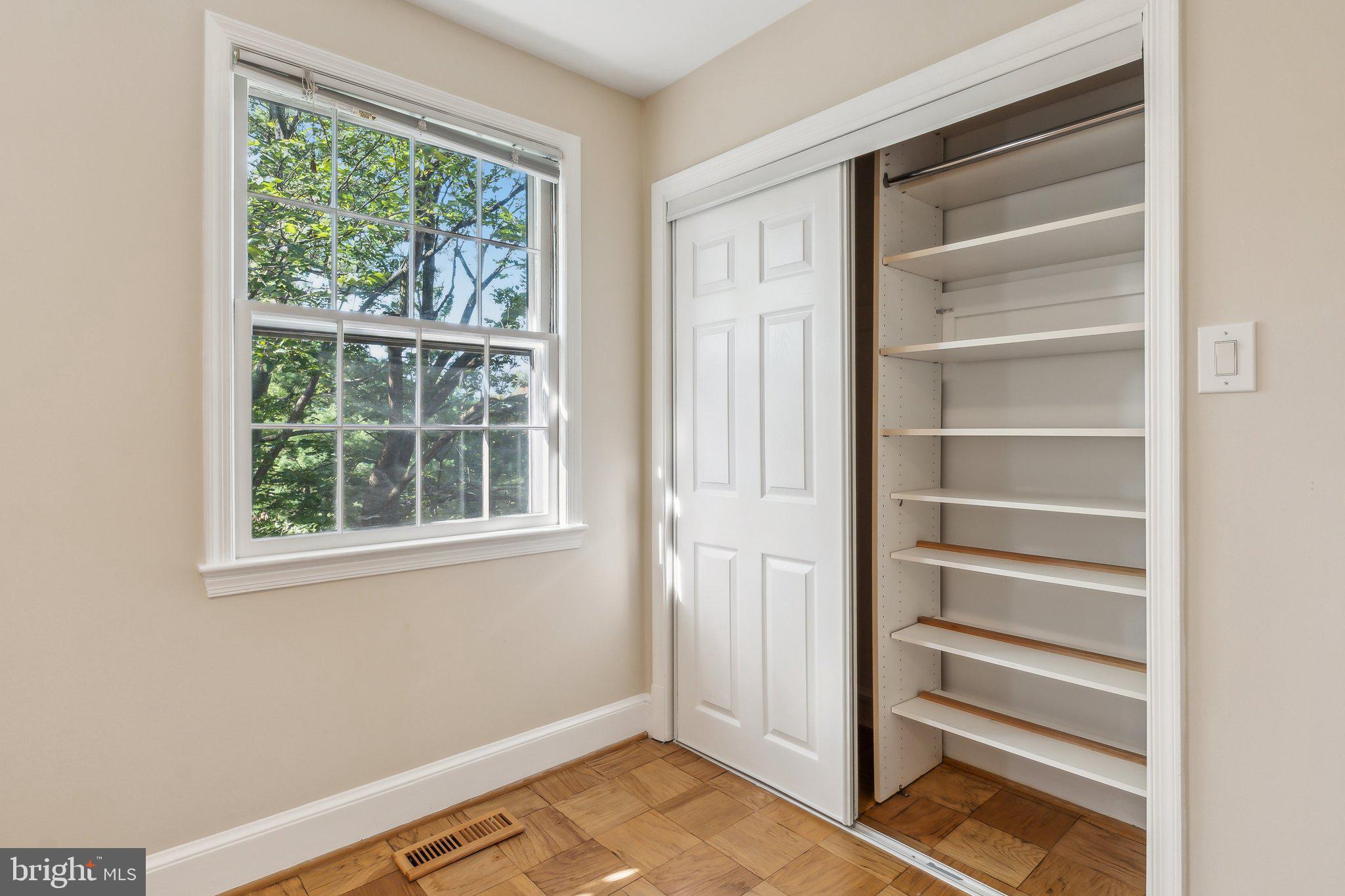 3205 Sutton Place Northwest, Unit A Washington, DC 20016 - Photo 30 of 44 a view of an empty room with a window