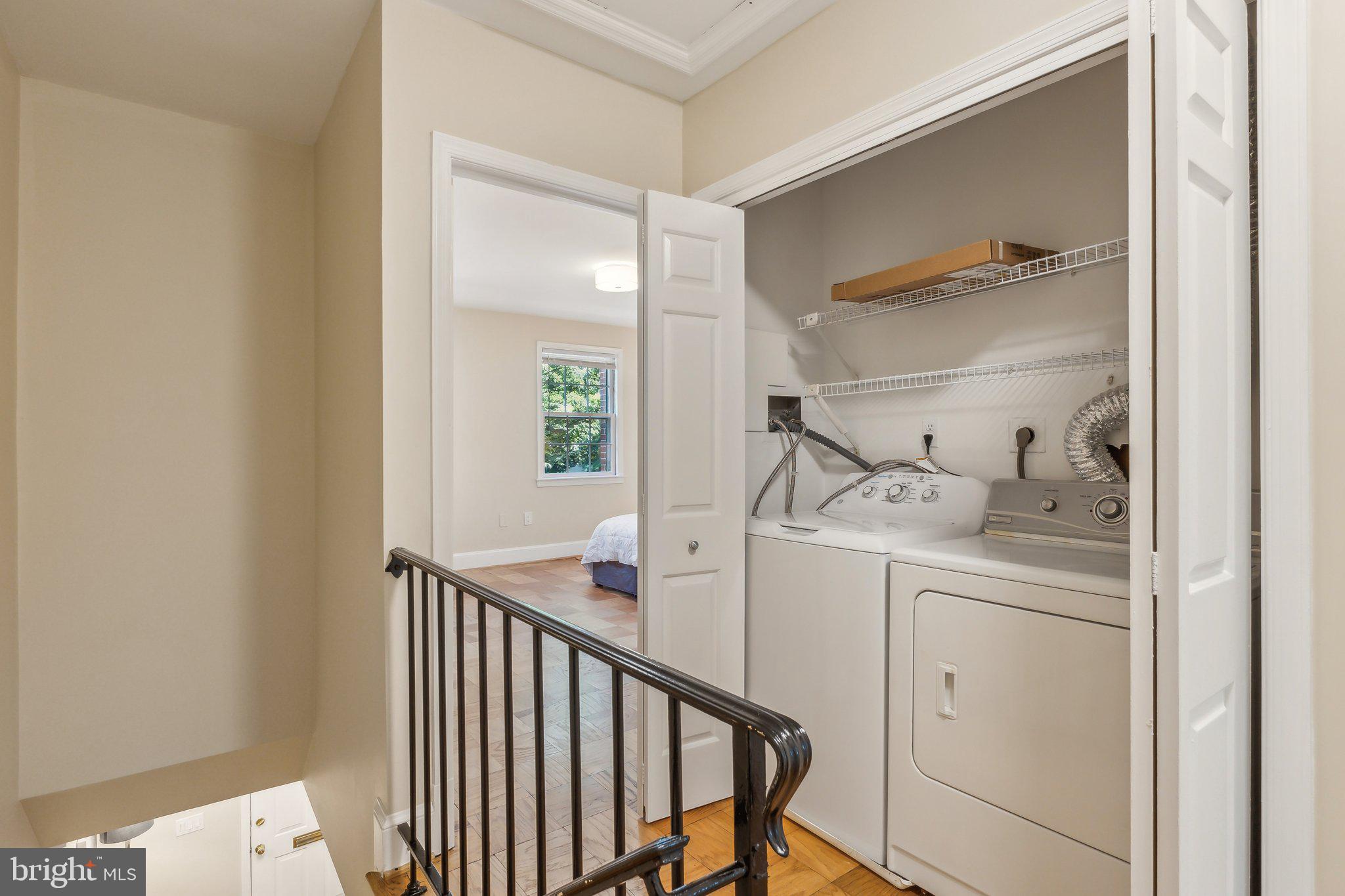 3205 Sutton Place Northwest, Unit A Washington, DC 20016 - Photo 32 of 44 a view of hallway with washer and dryer