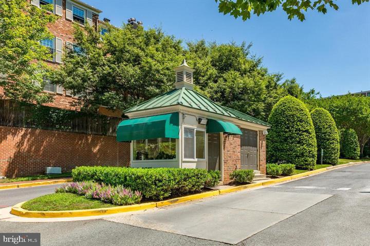 3205 Sutton Place Northwest, Unit A Washington, DC 20016 - Photo 34 of 44 front view of a house with a yard