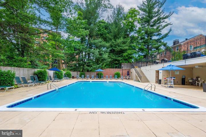 3205 Sutton Place Northwest, Unit A Washington, DC 20016 - Photo 36 of 44 a view of a swimming pool with a patio