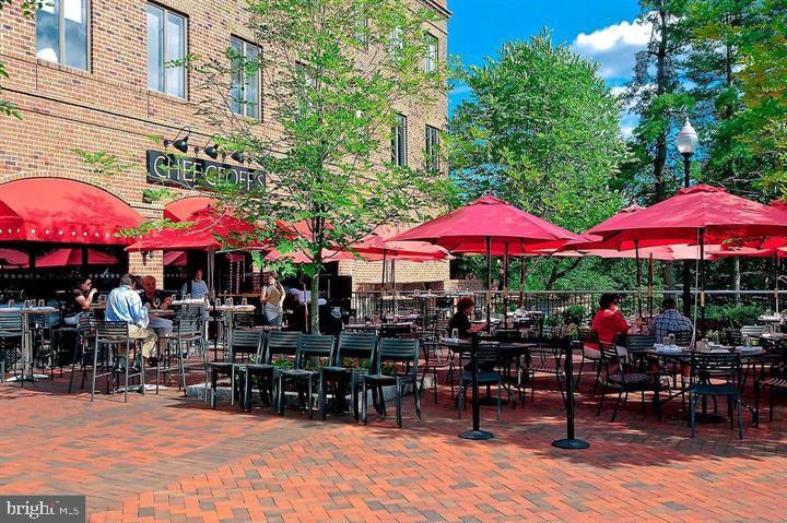 3205 Sutton Place Northwest, Unit A Washington, DC 20016 - Photo 38 of 44 an outdoor space with patio and umbrella