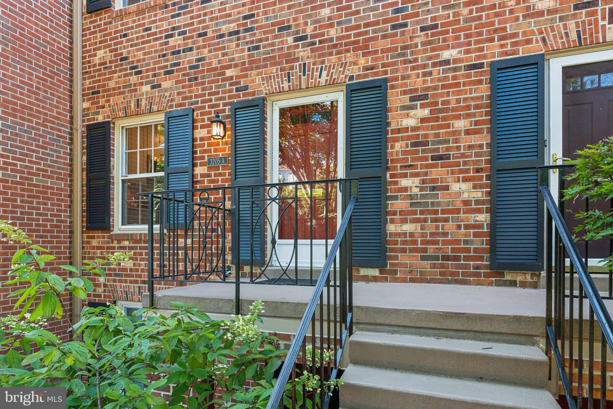 3205 Sutton Place Northwest, Unit A Washington, DC 20016 - Photo 42 of 44 a view of front door of house with stairs