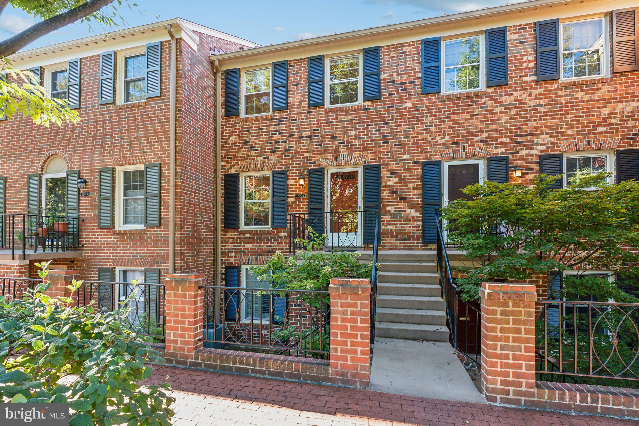 3205 Sutton Place Northwest, Unit A Washington, DC 20016 - Photo 43 of 44 a front view of a house having yard