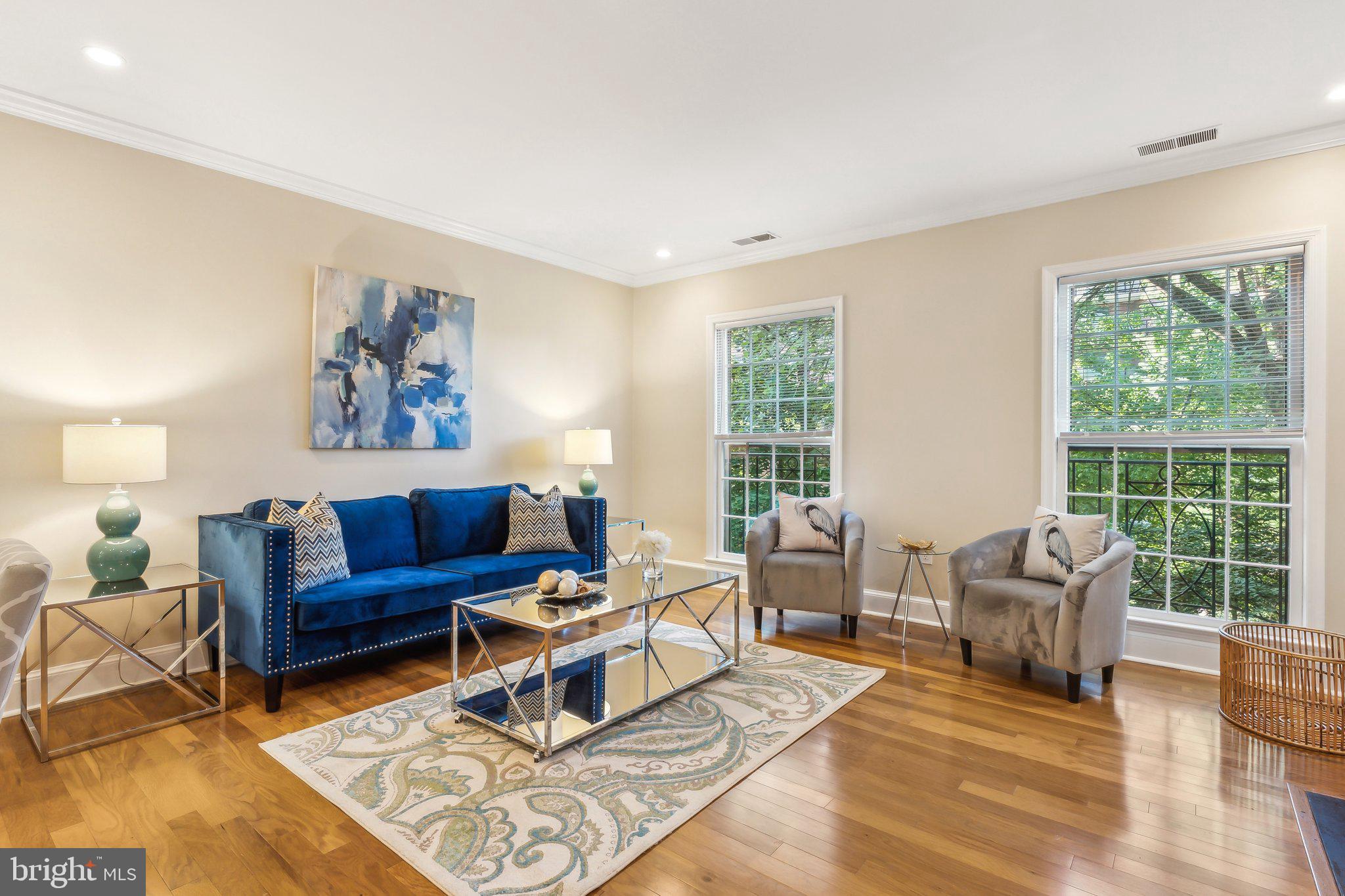 3205 Sutton Place Northwest, Unit A Washington, DC 20016 - Photo 8 of 44 a living room with furniture and a large window