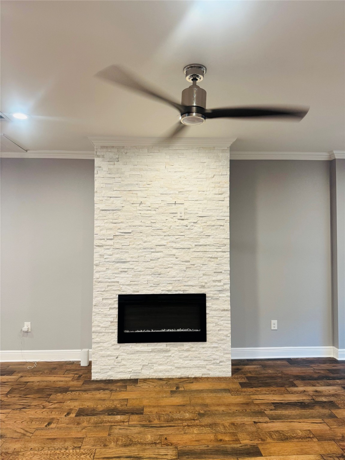 5317 Higgins Street Houston, TX 77033 - Photo 11 of 50 a view of empty room with wooden floor and fireplace