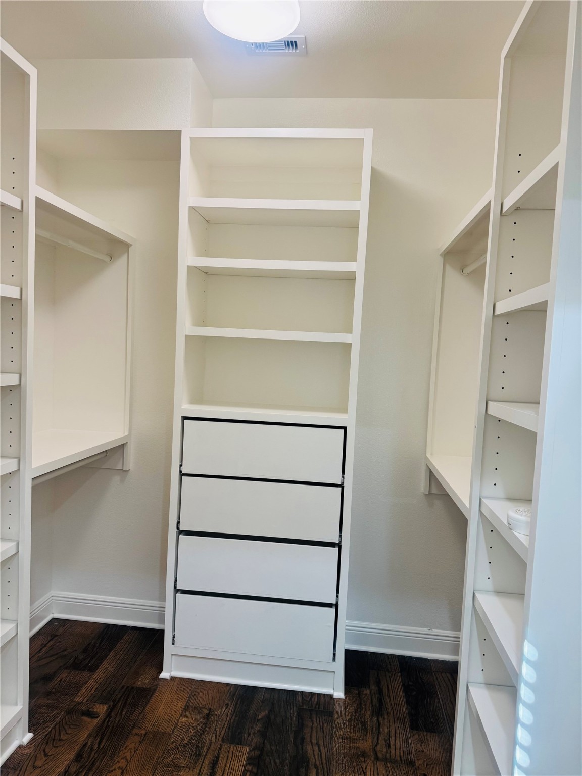 5317 Higgins Street Houston, TX 77033 - Photo 15 of 50 a view of walk in closet with empty racks