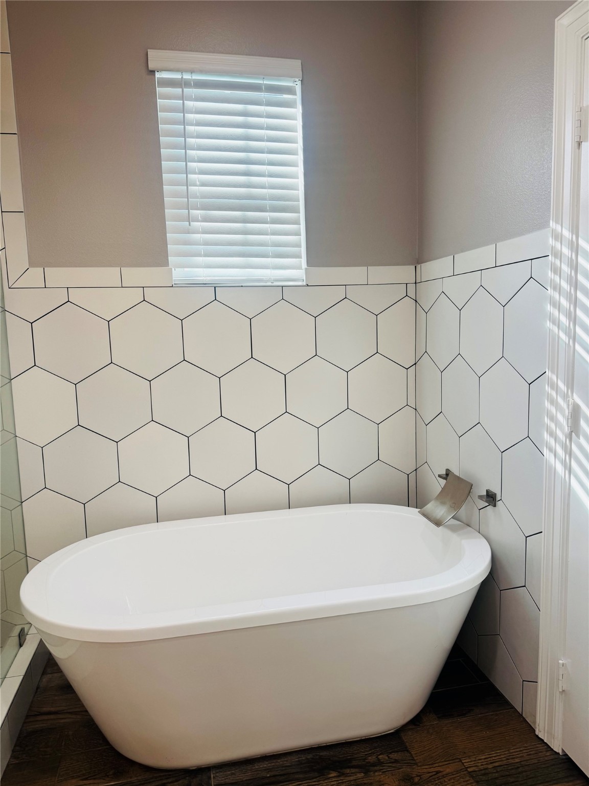 5317 Higgins Street Houston, TX 77033 - Photo 17 of 50 a white bath tub sitting in a bathroom