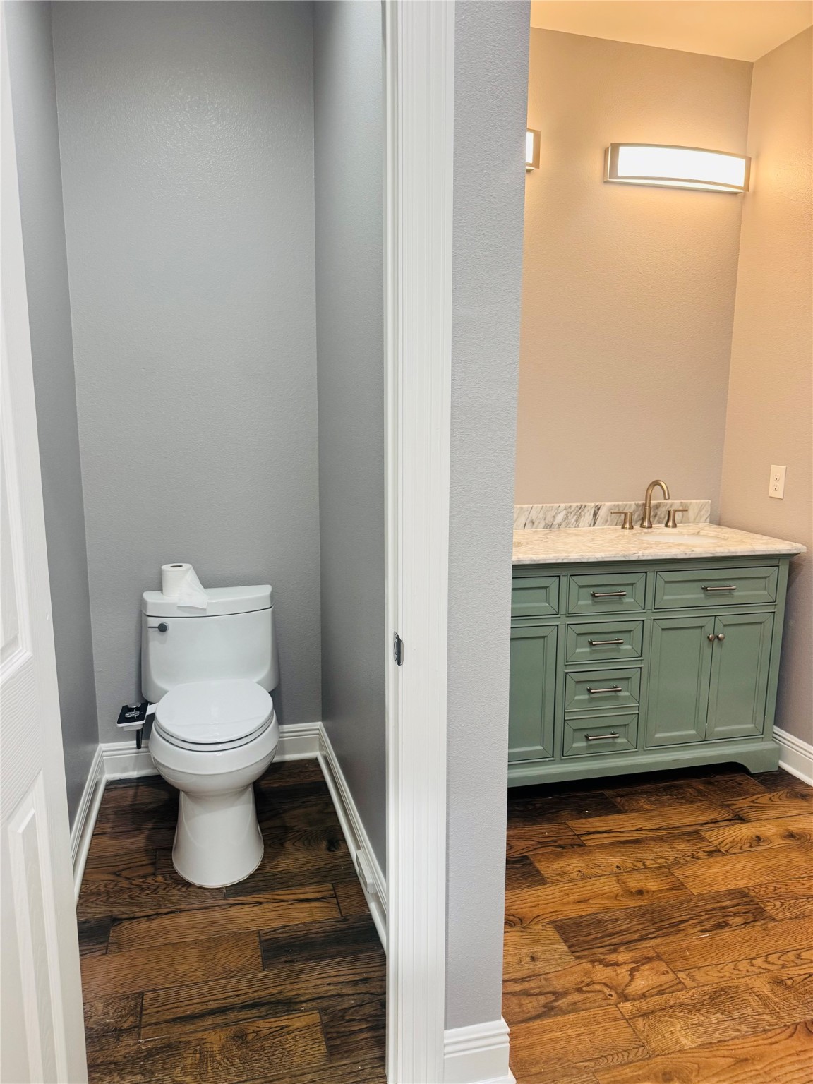 5317 Higgins Street Houston, TX 77033 - Photo 19 of 50 a bathroom with a toilet and a sink