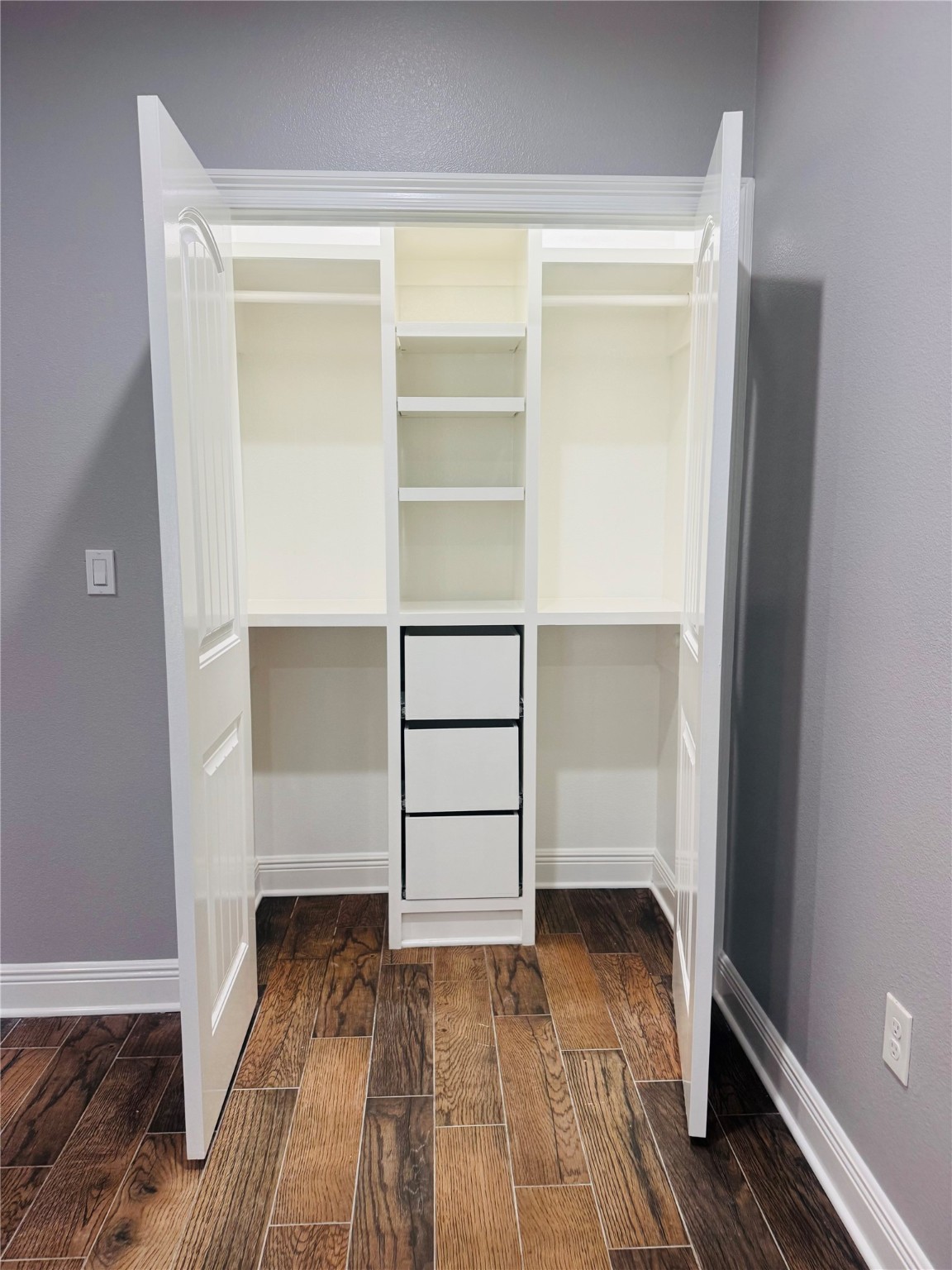 5317 Higgins Street Houston, TX 77033 - Photo 23 of 50 a view of walk in closet with empty racks