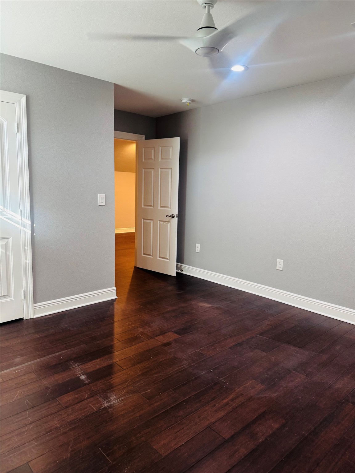 5317 Higgins Street Houston, TX 77033 - Photo 34 of 50 a view of an empty room with wooden floor and a window