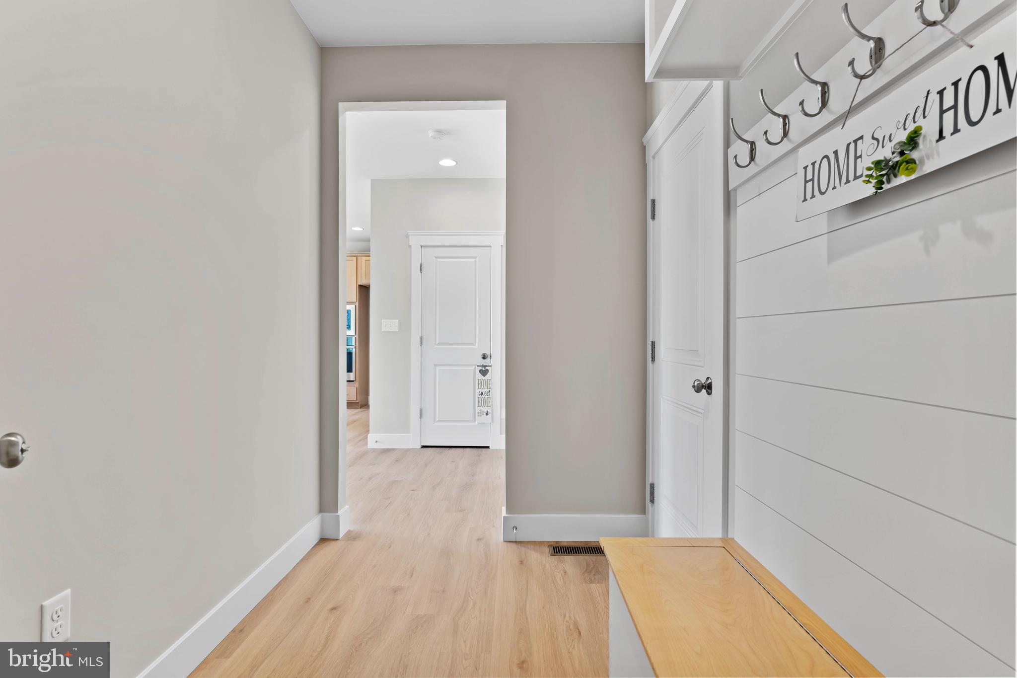 1010 Edorma Court Harrisburg, PA 17112 - Photo 17 of 38 a view of a hallway with wooden floor and a bathroom
