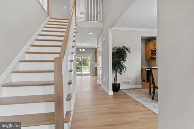a view of a room with wooden floor and windows