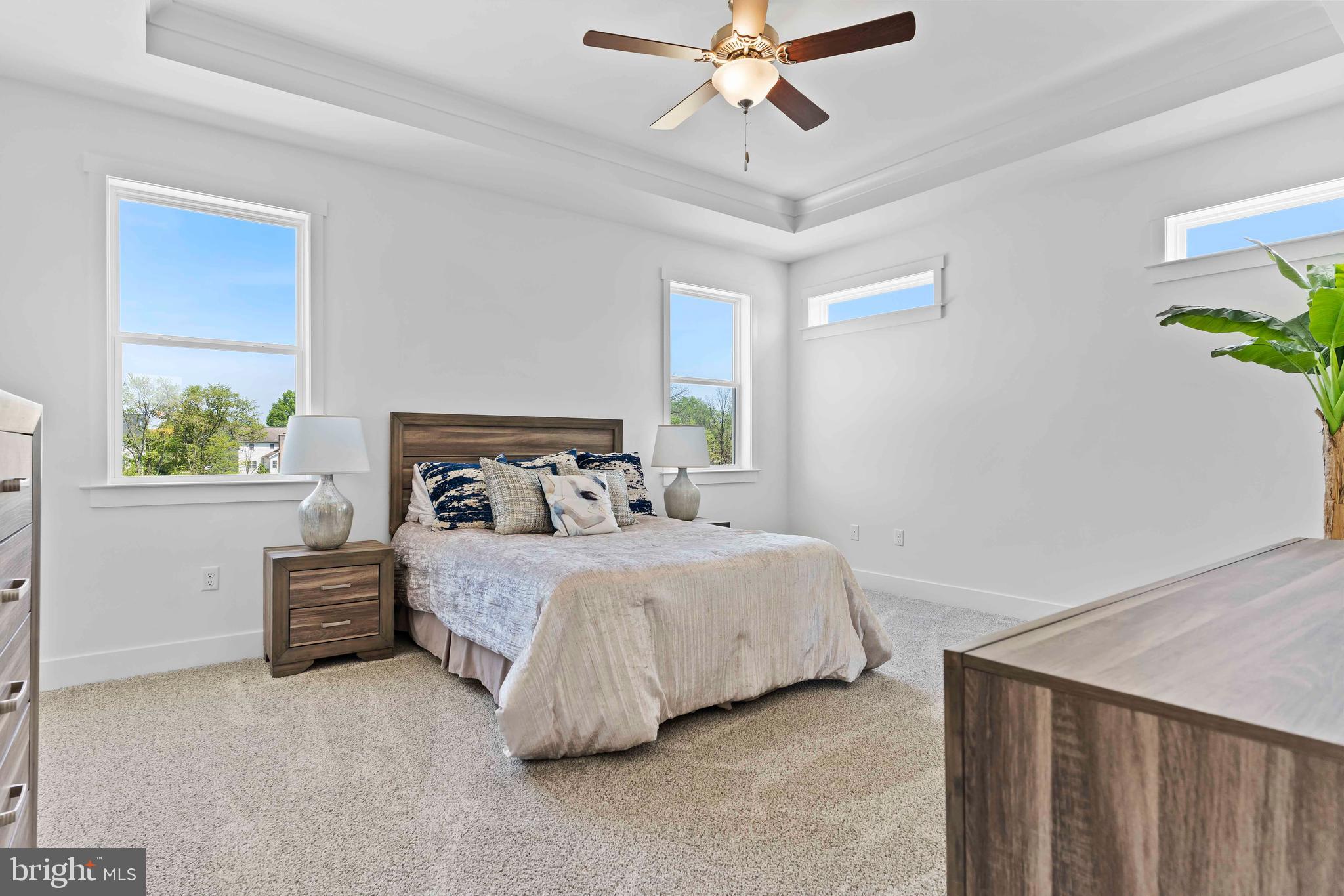 1010 Edorma Court Harrisburg, PA 17112 - Photo 23 of 38 a bedroom with a bed and a chandelier