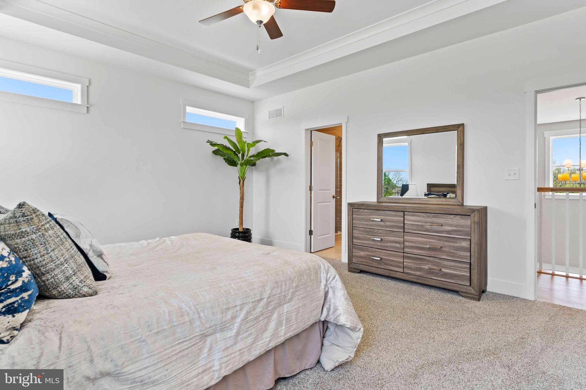 1010 Edorma Court Harrisburg, PA 17112 - Photo 24 of 38 a bedroom with a bed and a chandelier