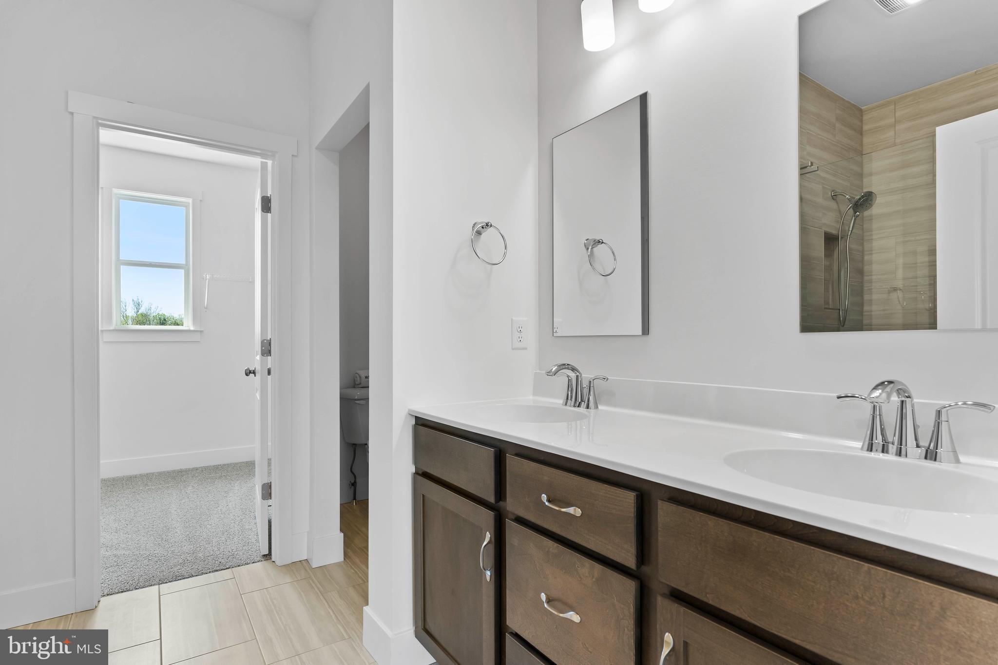 1010 Edorma Court Harrisburg, PA 17112 - Photo 26 of 38 a bathroom with a sink and a mirror