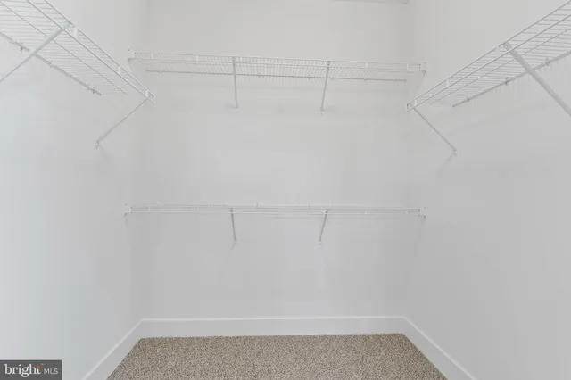 a view of a room with racks on the wall