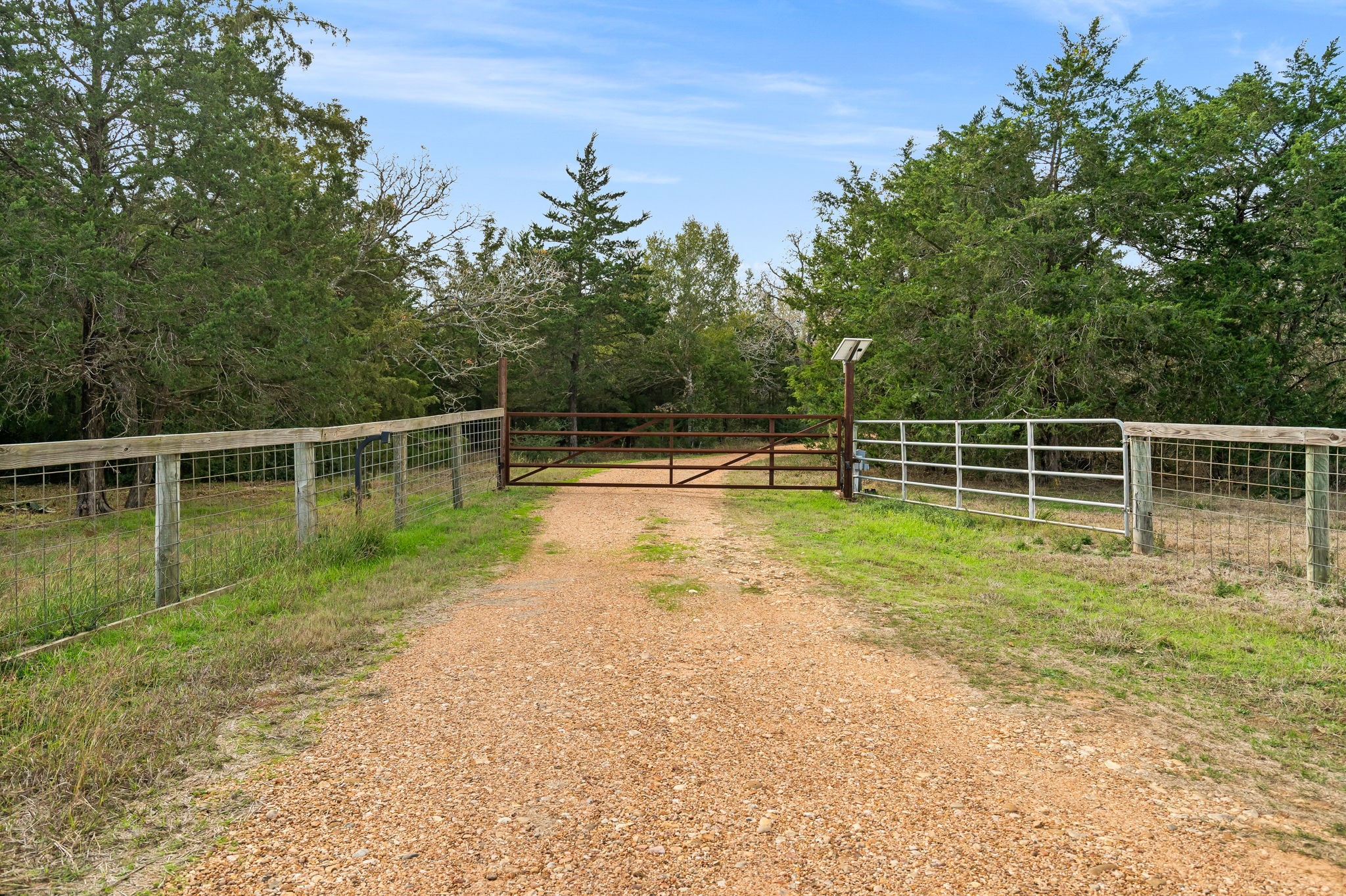 1925 Hills Road Carmine, TX 78932 - Photo 2 of 49 a view of a yard with a wooden fence
