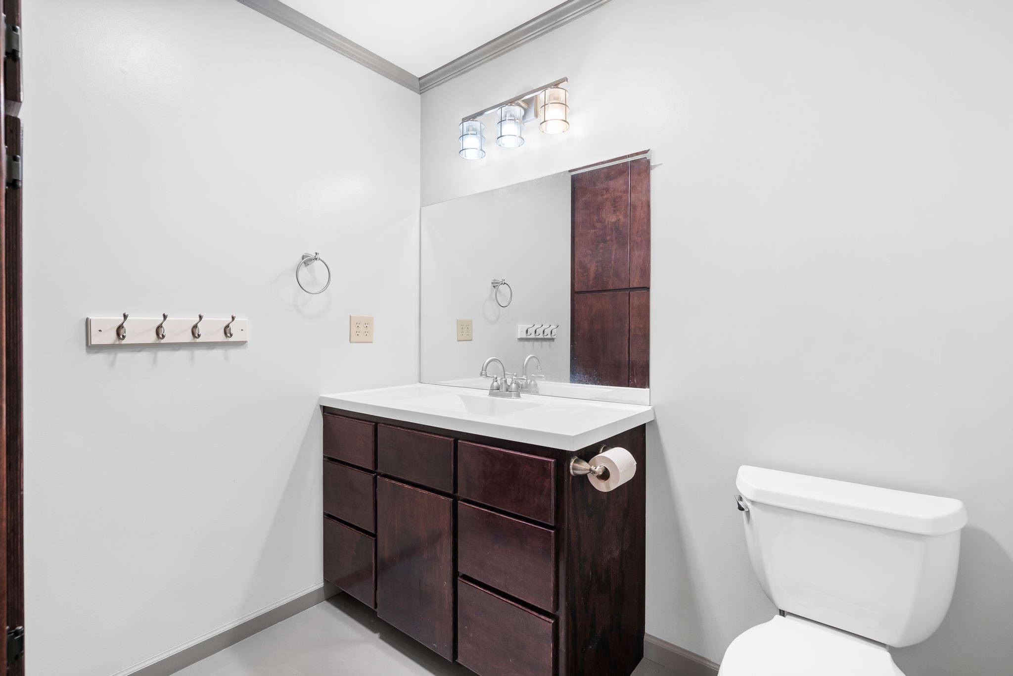 1925 Hills Road Carmine, TX 78932 - Photo 33 of 49 a bathroom with a toilet sink and mirror