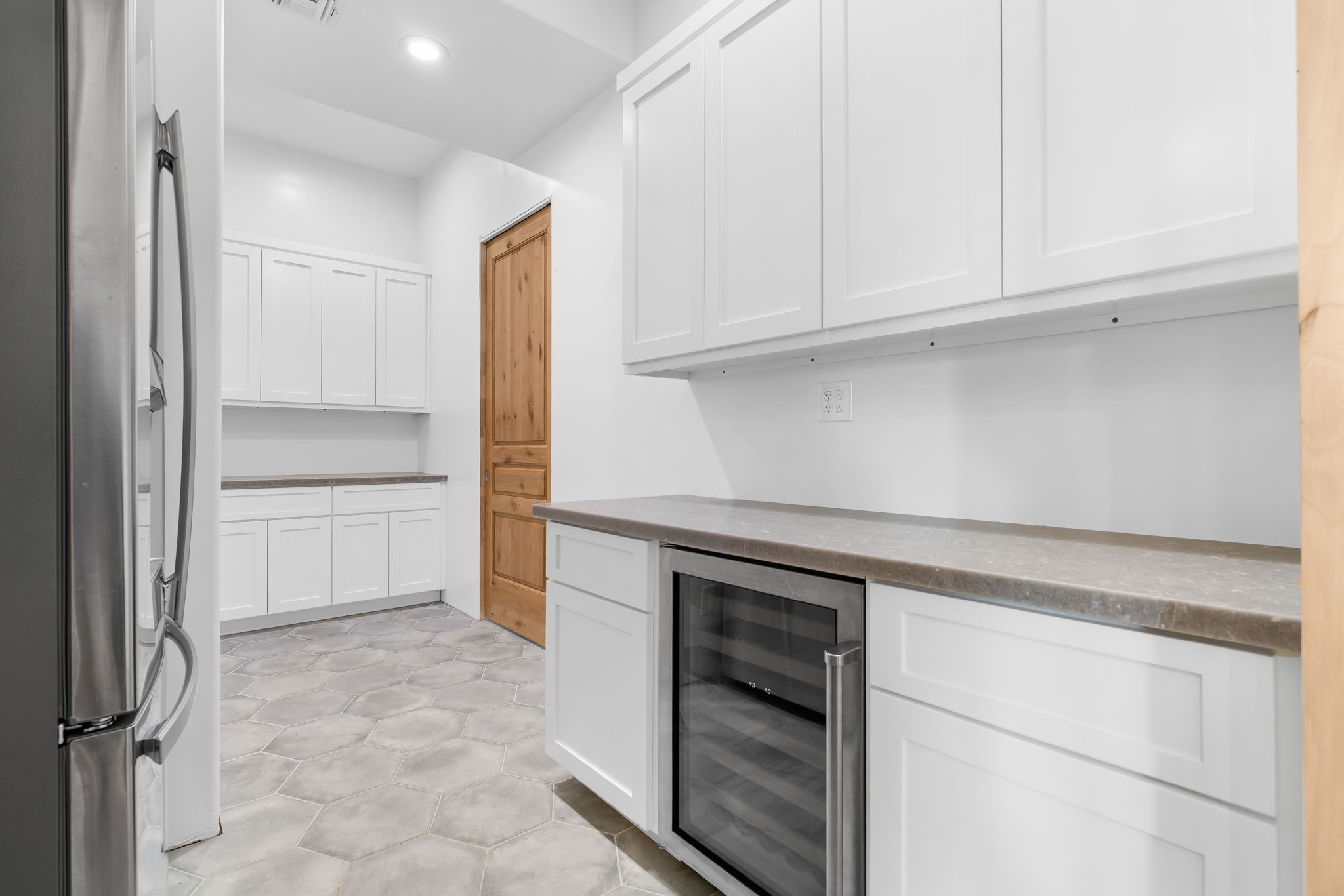 1925 Hills Road Carmine, TX 78932 - Photo 39 of 49 a kitchen with white cabinets and a refrigerator