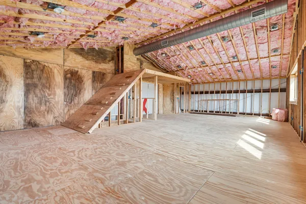 a view of a room with wooden walls