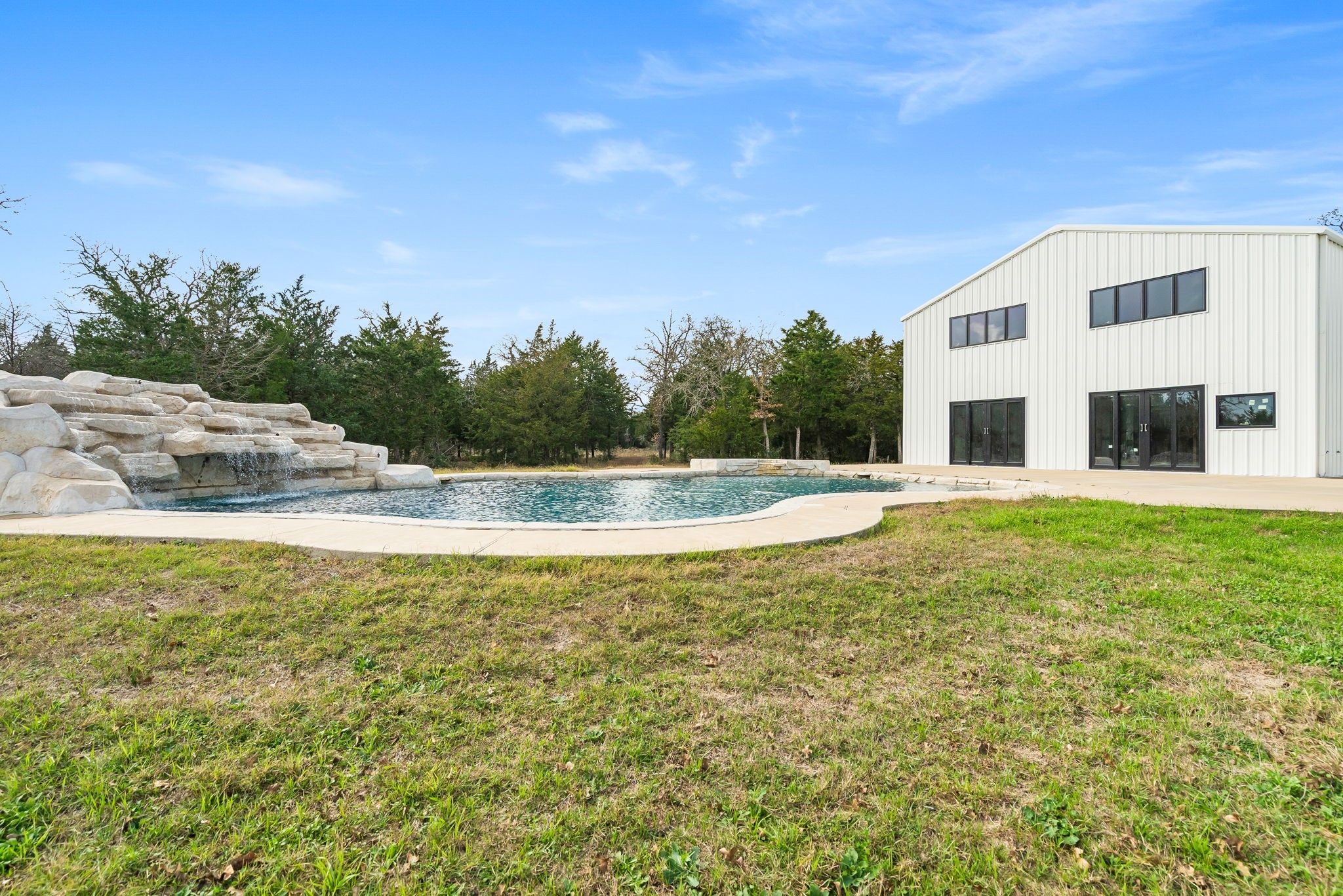 1925 Hills Road Carmine, TX 78932 - Photo 46 of 49 a view of a swimming pool with an outdoor space and seating area