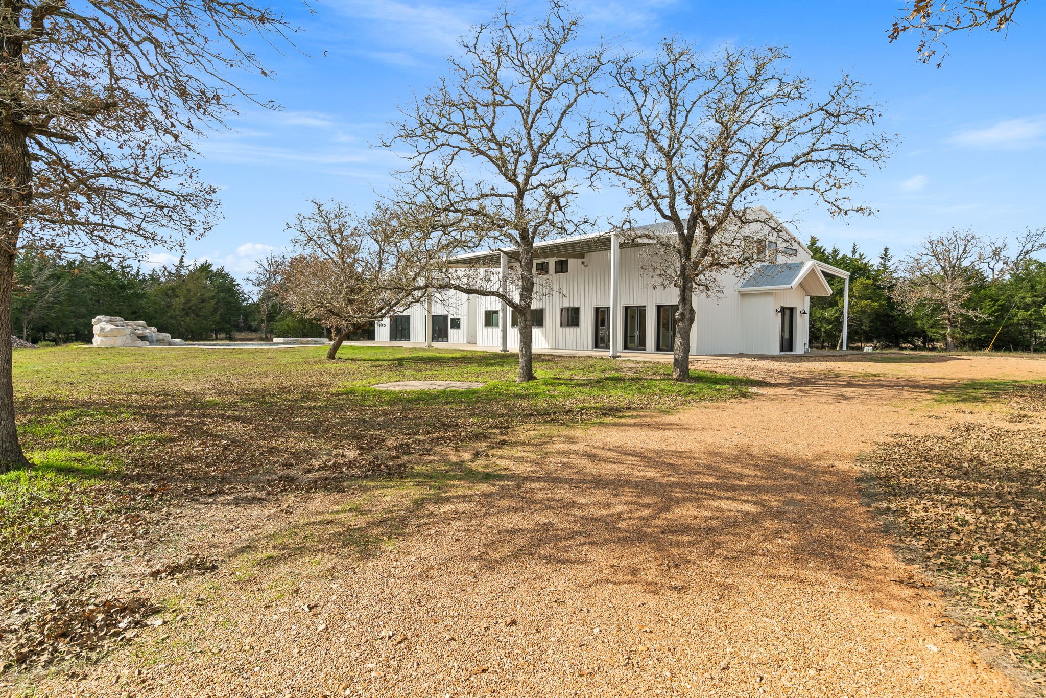 1925 Hills Road Carmine, TX 78932 - Photo 8 of 49 a front view of a building with a yard